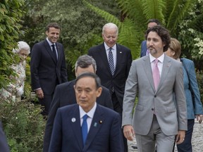 Prime Minister Justin Trudeau (in grey suit) is seen with other world leaders as they arrive for drinks at a reception for Queen Elizabeth during the G7 Summit on June 11, 2021 in Cornwall, England.