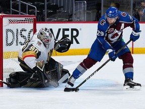 Colorado Avalanche center Nathan MacKinnon (29) controls the puck in front of Vegas Golden Knights goaltender Robin Lehner (90) in the third period of game one in the second round of the 2021 Stanley Cup Playoffs at Ball Arena.