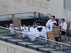 Kenney and some cabinet ministers are pictured on a patio in the Federal Building in Edmonton taken on June 1, 2021. From the top right is Jason Nixon, Minister of Environment & Parks, Government House Leader, Health Minister Tyler Shandro and with his back to the camera is Premier Jason Kenney.