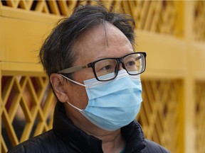 Billy Chai wears a face mask in downtown Edmonton during the COVID-19 pandemic on Tuesday, June 8, 2021.