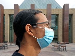 Austin Contois-Crane wears a face mask outside Edmonton City Hall on Tuesday June 22, 2021.