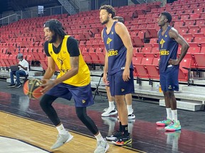 Edmonton Stingers Marlon Johnson, left, Brady Skeens, middle, and Kamel Archer take part in training camp at the Edmonton Expo Centre on June 22, 2021. The Stingers open defence of their CEBL title on Saturday against the Hamilton Honey Badgers.