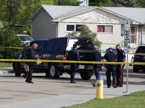 ASIRT and Edmonton police investigate the area on Sunday, June 6, 2021 after a man was shot and killed in a confrontation with police near 134 Avenue and 107 Street in Edmonton’s Rosslyn neighbourhood  on Saturday night.