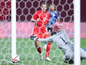Christine Sinclair (No. 12) of Canada scores during the Women's First Round Group E match between Japan and Canada during the Tokyo 2020 Olympic Games at Sapporo Dome on July 21, 2021 in Sapporo, Hokkaido, Japan.
