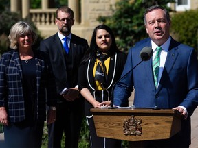 Premier Jason Kenney speaks alongside new cabinet members after a swearing in ceremony at Government House in Edmonton, on Thursday, July 8, 2021. Government ministers and associate ministers were sworn in as part of a cabinet shuffle.
