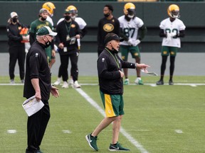 Head coach and offensive coordinator Jaime Elizondo (right) directs practice during Edmonton Elks training camp at Commonwealth Stadium in Edmonton, on Tuesday, July 20, 2021. The team faces the Ottawa Redblacks in their first CFL game of the season at home on Aug. 7.