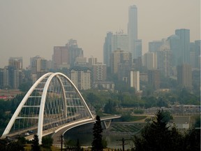 The downtown Edmonton skyline was shrouded in smoke from the wildfires in British Columbia on Thursday July 15, 2021. (PHOTO BY LARRY WONG/POSTMEDIA)