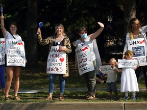 About 100 nurses and supporters staged a protest rally outside the Sturgeon Community Hospital in St. Albert on Monday, July 26, 2021, to protest proposed wage rollbacks and other changes in a new collective agreement.