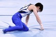 Japan's Kohei Uchimura reacts after falling down during the horizontal bars event of the artistic gymnastics men's qualification during the Tokyo 2020 Olympic Games.