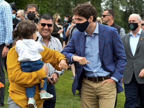 Prime Minister Justin Trudeau greets people at Town Centre Park in Coquitlam, British Columbia on July 8, 2021.
