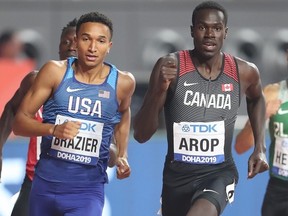 Marco Arop of Canada, right, competes at the 2019 World Athletic Championships in Doha, Qatar.