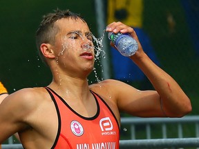 Canadian Tyler Mislawchuk cools down on the run during the 2015 Pan Am Games in Toronto on July 12, 2015.