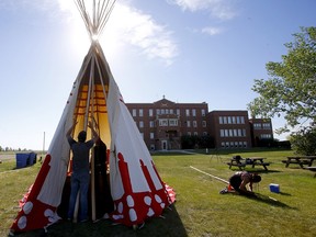 A teepee is set up at the Old Sun Community College on the Siksika Nation on June 2, 2021. The college was used as a residential school from 1929 to 1969. Residents dropped off stuffed animals to remember the 215 children discovered buried on the grounds of the former Kamloops Indian Residential School.