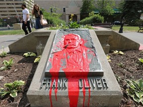 Red paint has been splashed on the Frank Oliver monument in Frank Oliver Park, 6166 100 St., in Edmonton Friday July 2, 2021. Frank Oliver was an Edmonton-based federal member of parliament and minister who was instrumental in the removal of Indigenous people from their land by introducing the Oliver Act. Photo by David Bloom