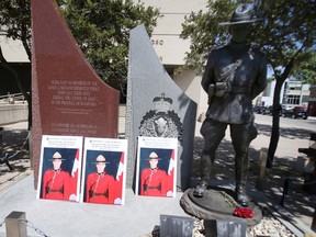 Flowers and photographs placed at a statue at RCMP D Division, in Winnipeg honour Const. Shelby Patton of the RCMP, who was killed on duty in Wolseley, Sask., on June 12, 2021. .  Tuesday, June 15, 2/2021.Winnipeg Sun/Chris Procaylo/stf