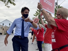 Prime Minister Justin Trudeau is greeted by Liberal party supporters in the riding of Hastings–Lennox and Addington outside the Waterfront River Pub and Terrace in Napanee during a campaign stop on Monday evening. The Liberals have called a federal election for Monday, Sept. 20, 2021. Meghan Balogh/The Kingston Whig-Standard/Postmedia Network