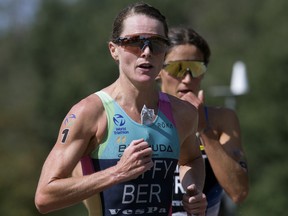 Flora Duffy runs the elite women's race at the 2021 World Triathlon championship finals in Edmonton on Saturday, Aug. 21, 2021.