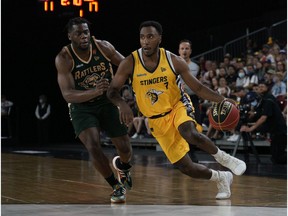 Edmonton Stinger Kareem South (right) drives to the basket past Saskatchewan Rattler Kemy Osse during Canadian Elite Basketball League game action in Edmonton on Monday August 2, 2021.