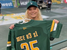 Chantelle Miller poses with her custom jersey before the Elks game Saturday, August 7, 2021, at Commonwealth Stadium in Edmonton, Alberta. Supplied