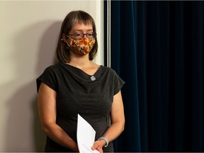 Alberta chief medical officer of health Dr. Deena Hinshaw waits to speak at a news conference about back-to-school guidance and the postponement of the relaxation of COVID-19 regulations for six weeks at the Alberta legislature in Edmonton on Friday, Aug. 13, 2021.