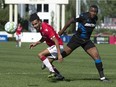 Cavalry FC Mohamed Farsi (L) competes for the ball in the area during CPL soccer action between FC Edmonton and Cavalry FC in Calgary at Atco Field on Sunday, Aug. 29, 2021.