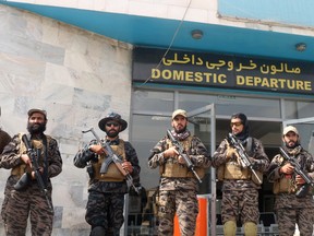 Taliban forces stand guard a day after the U.S. troops withdrawal from Hamid Karzai international airport n Kabul, Afghanistan August 31, 2021. REUTERS/Stringer