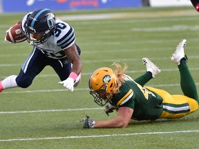 Edmonton Elks James Tuck, seen here tripping up Toronto Argonauts running back Martese Jackson (30) at Commonwealth Satdium in this file photo from Oct. 14, 2017, came up painfully short of the end zone in Saturday's season opener against the Ottawa Redblacks.