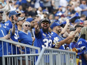Winnipeg Blue Bombers fans taunt Hamilton Tiger-Cats fans in Winnipeg on Thursday, August 5, 2021.