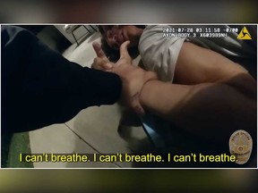 Jaxson Hayes is seen being held down by Los Angeles Police Department officers outside his home in a screengrab taken from a police body cam video shared on the LAPD YouTube channel.