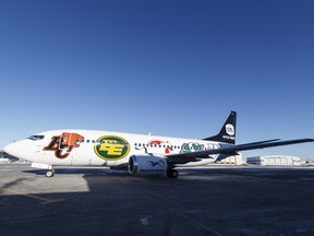 A Canadian North CFL plane lands as the Edmonton club returns as Grey Cup champions at Executive Flight Centre in Nisku on Nov. 30, 2015.