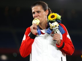 Gold medalist Christine Sinclair of Team Canada poses with their gold medal during the Women's Football Competition Medal Ceremony at the Tokyo 2020 Olympic Games at International Stadium Yokohama on Aug. 6, 2021 in Yokohama, Japan.
