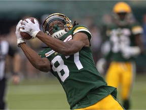 Edmonton Elks' Derel Walker (87) makes the catch again the Montreal Alouettes during second half CFL action in Edmonton on Saturday, Aug. 14, 2021.