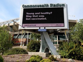 An advertisement promoting COVID-19 vaccinations is visible on a digital billboard outside Commonwealth Stadium, in Edmonton Monday Aug. 30, 2021. The Edmonton Elks are requiring fans attending games to show proof of vaccination or a negative COVID-19 test as of Oct. 15. Photo by David Bloom