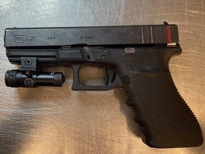 Trafficked handgun seized in 2021. The Edmonton Police Service has arrested and charged two men with multiple firearms-related offences in connection to a straw buying operation.