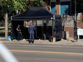 Edmonton homicide detectives investigate the scene of a suspicious death of a man in his 20s found at a bus stop around 3:30 a.m., Sept. 4, 2021, near 118 Avenue and 85 Street.
