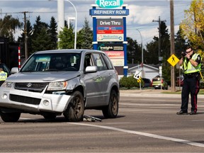 Edmonton Police Service officers investigate after two seniors were sent to hospital in a hit-and-run collision by the driver at 50 Street at 101 Avenue in Edmonton, on Friday, Sept. 10, 2021. Police responded to reports of a collision between the two pedestrians and a 2017 Honda Civic being driven by the teenager northbound on 50 Street, when the driver attempted to turn westbound on to 101 Avenue. The vehicle allegedly turned into oncoming traffic, and collided with a Subaru SUV that was travelling southbound on 50 Street through the intersection.