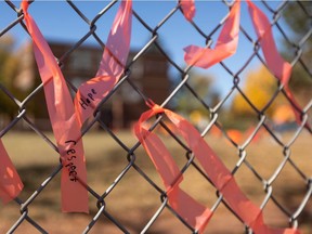 Students at Garneau School tied ribbons on the fence for Orange Shirt Day in Edmonton, on Wednesday, Sept. 29, 2021. National Day for Truth & Reconciliation is Sept. 30 and honours the lost children and Survivors of residential schools, their families and communities.