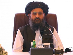 In this file photo taken July 18, 2021, the leader of the Taliban negotiating team Mullah Abdul Ghani Baradar looks on during the final declaration of the peace talks between the Afghan government and the Taliban presented in Qatar's capital Doha.