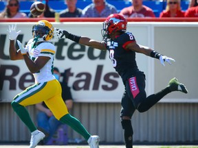 Edmonton Elks receiver Earnest Edwards makes a touchdown catch in front of DaShaun Amos of the Calgary Stampeders in Calgary on Monday, Sept. 6, 2021.