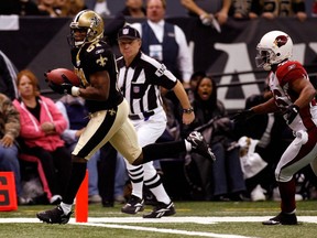 David Patten, left is seen scoring a touchdown while playing with the Saints in a game against the Cardinals in New Orleans, Dec. 16, 2007.