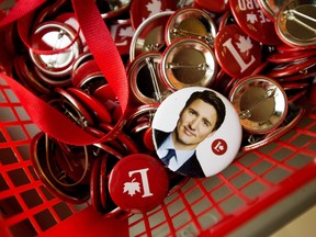 Campaign buttons, including one of Justin Trudeau, sit in a basket at Edmonton Centre Liberal candidate Randy Boissonnault's campaign office, Sept. 20, 2021.