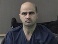 In this photo released by the Bell County Sheriff's Office, U.S. Maj. Nidal Hasan, the Army psychiatrist who murdered 13 in the Fort Hood shooting, is seen in a booking photo on April 9, 2010 in Belton, Texas.