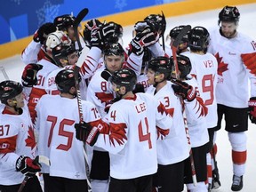 Canada's men's hockey team celebrate winning the bronze medal against the Czech Republic during the Pyeongchang Winter Olympics at the Gangneung Hockey Centre in Gangneung, South Korea, Feb. 24, 2018.