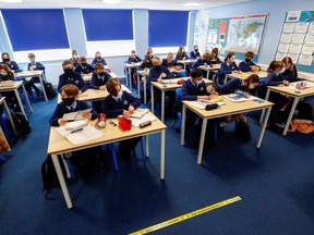 Students attend a lesson at Weaverham High School, in Cheshire, England, March 9, 2021.