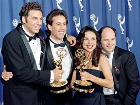 In this file photo taken on September 19, 1993 The cast of the Emmy-winning "Seinfeld" show (L-R) Michael Richards, Jerry Seinfeld, Julia Louis-Dreyfus and Jason Alexander pose with the Emmys they won for Outstanding Comedy Series on in Pasadena, California.
