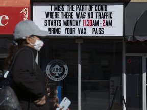 vaccine, passport, Alberta,



A pedestrian makes their way past a COVID-19 sign outside SOHO, 11454 Jasper Ave., in Edmonton Thursday Sept. 23, 2021. Photo by David Bloom