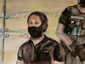 An artist's sketch shows Salah Abdeslam, one of the accused, who is widely-believed to be the only surviving member of the group suspected of carrying out the Paris' November 2015 attacks, on the first day of trial at the Paris courthouse on the Ile de la Cite in Paris, France, September 8, 2021.