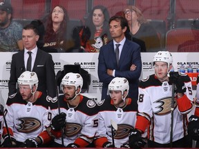 Anaheim Ducks Head coach Dallas Eakins watches from the bench during the third period of the NHL game against the Arizona Coyotes at Gila River Arena on October 02, 2021 in Glendale, Arizona.