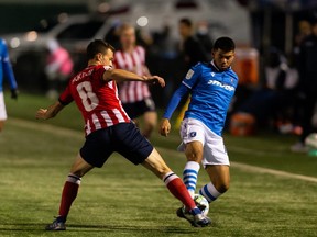 FC Edmonton’s Azriel Gonzalez (11) battles Atlético Ottawa’s McKendry (8) during the first half of Canadian Premier League action at Clarke Stadium in Edmonton, on Tuesday, Oct. 12, 2021.