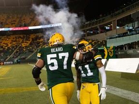 Edmonton Elks receiver Shai Ross (11) celebrates a touchdown against the Winnipeg Blue Bombers with centre David Beard (57) at Commonwealth Stadium in Edmonton on Friday, Oct. 15, 2021.